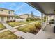 Charming townhome neighborhood with well-maintained lawns, walkways, and colorful exteriors at 21422 E 47Th Ave, Denver, CO 80249