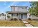 Charming two-story home with a covered porch and well-maintained front yard at 21422 E 47Th Ave, Denver, CO 80249