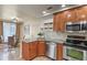 Modern kitchen featuring stainless steel appliances and ample counter space at 21422 E 47Th Ave, Denver, CO 80249