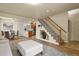 Open-concept living and dining area with modern furnishings at 21422 E 47Th Ave, Denver, CO 80249