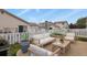 Outdoor patio with comfortable seating surrounded by privacy fence and well kept landscaping at 21422 E 47Th Ave, Denver, CO 80249