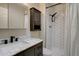 Modern bathroom with a marble countertop vanity and sleek subway tile shower at 6844 S Broadway, Littleton, CO 80122