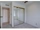 Cozy bedroom featuring mirrored closet doors and neutral decor at 6844 S Broadway, Littleton, CO 80122