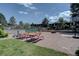 Complex features common area with picnic tables, a playground, and recreational area at 6844 S Broadway, Littleton, CO 80122