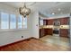 Charming dining area flows into kitchen and features custom cabinets, granite countertops, and appliances at 6844 S Broadway, Littleton, CO 80122