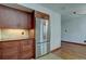 Updated kitchen featuring stainless steel appliances and custom cabinets at 6844 S Broadway, Littleton, CO 80122