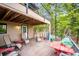 Cozy back deck that is shaded with an outdoor dining area at 11094 Thomas Dr, Conifer, CO 80433
