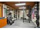 Spacious basement gym with weights, mirror and workout equipment at 11094 Thomas Dr, Conifer, CO 80433