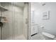 Bright bathroom featuring white marble shower and vanity at 11094 Thomas Dr, Conifer, CO 80433