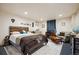 Comfortable bedroom providing a relaxed ambiance with natural light and simple decorations at 11094 Thomas Dr, Conifer, CO 80433