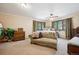 Relaxing bedroom with neutral tones, comfortable seating, and serene outdoor views at 11094 Thomas Dr, Conifer, CO 80433