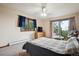 Bright bedroom features natural light, balcony access, and a calming view of surrounding nature at 11094 Thomas Dr, Conifer, CO 80433