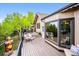 Outdoor deck featuring comfortable seating, a grill, and scenic views of the surrounding nature at 11094 Thomas Dr, Conifer, CO 80433