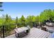 Scenic deck with a beautiful forest view, perfect for outdoor dining and relaxation at 11094 Thomas Dr, Conifer, CO 80433