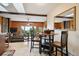 Cozy dining area with wood table and chairs adjacent to living room at 11094 Thomas Dr, Conifer, CO 80433