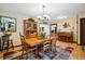 Host guests in this well-lit dining room with a large wooden table and seating for six at 11094 Thomas Dr, Conifer, CO 80433