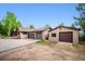 Home exterior with multiple car garage and extended parking at 11094 Thomas Dr, Conifer, CO 80433