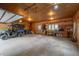 Spacious garage with high ceilings, providing ample space for storage and vehicles at 11094 Thomas Dr, Conifer, CO 80433