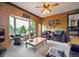 Bright, inviting living room with a large bay window showcasing outdoor views at 11094 Thomas Dr, Conifer, CO 80433