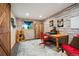 Bright office offers a stone accent wall and wooden desk at 11094 Thomas Dr, Conifer, CO 80433