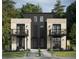 Contemporary townhome with brick and modern siding, featuring balconies and manicured landscaping at 2453 Julian St, Denver, CO 80211