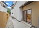 Private backyard with gravel pathway and access to interior at 1717 Grove St, Denver, CO 80204