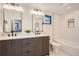 Modern bathroom with double vanity and bathtub at 1717 Grove St, Denver, CO 80204