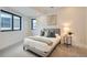 Bright bedroom with carpeted floor and large window at 1717 Grove St, Denver, CO 80204