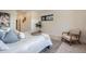 Modern bedroom with a queen bed and an armchair at 1717 Grove St, Denver, CO 80204