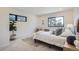 Modern bedroom with large windows and a comfy bed at 1717 Grove St, Denver, CO 80204