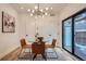Bright dining area with glass table and modern chairs, near sliding glass doors at 1717 Grove St, Denver, CO 80204