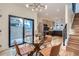 Modern dining area with glass table and leather chairs near kitchen at 1717 Grove St, Denver, CO 80204