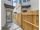 Townhouse entrance with private gated walkway and landscaping at 1717 Grove St, Denver, CO 80204