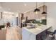 Modern kitchen with sleek cabinetry, quartz countertops, and a breakfast bar at 1717 Grove St, Denver, CO 80204