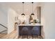 Modern kitchen with island and sleek pendant lights at 1717 Grove St, Denver, CO 80204