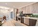 Modern kitchen with stainless steel appliances and light wood cabinets at 1717 Grove St, Denver, CO 80204