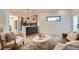 Open concept kitchen and living area, featuring modern cabinetry and a large island at 1717 Grove St, Denver, CO 80204