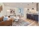 Open living space with kitchen island and hardwood floors at 1717 Grove St, Denver, CO 80204