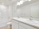 Bathroom with double vanity, mirror and bathtub at 18039 Dandy Brush Ln, Parker, CO 80134