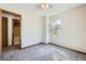 Cozy bedroom featuring soft carpeting, a large window with a view, and neutral walls at 3334 Navajo St, Denver, CO 80211