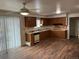 Cozy kitchen with wooden cabinets and laminate flooring at 1530 Whippoorwill Dr, Lakewood, CO 80215