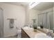 Well-lit bathroom featuring double sinks, modern fixtures, and a neutral color palette at 3754 Broadview Pl, Castle Rock, CO 80109