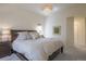 Bright bedroom showcasing a large bed, neutral walls, soft lighting and minimalist decor at 3754 Broadview Pl, Castle Rock, CO 80109