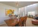 This dining room features natural light, seating for six, and adjacent views of an entry and living area at 3754 Broadview Pl, Castle Rock, CO 80109