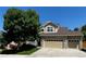 Beautiful two-story home with a stone facade, manicured lawn, and a spacious two-car garage at 3754 Broadview Pl, Castle Rock, CO 80109