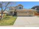 Charming two-story home featuring a three-car garage, stone accents and a well-manicured lawn at 3754 Broadview Pl, Castle Rock, CO 80109