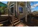Exterior view of the home with steps to the deck, landscaping, and natural light at 3754 Broadview Pl, Castle Rock, CO 80109