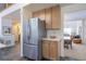The kitchen shows stainless appliances and views to an eat-in space and entry way at 3754 Broadview Pl, Castle Rock, CO 80109