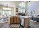 Bright, open kitchen featuring white countertops, stainless steel dishwasher, and adjacent dining and living areas at 3754 Broadview Pl, Castle Rock, CO 80109
