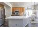 Bright kitchen with a spacious island, stainless steel appliances, and ample cabinet space at 3754 Broadview Pl, Castle Rock, CO 80109